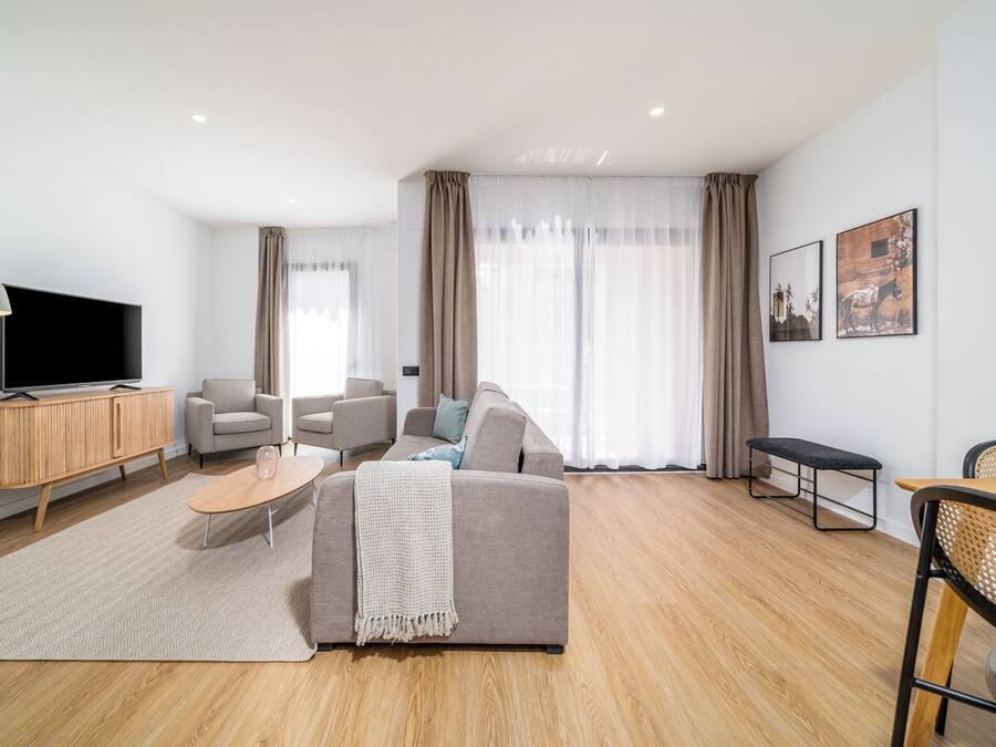 Two-Bedroom Family Apartment with Terrace | Living area | 50-inch flat-screen TV with cable channels