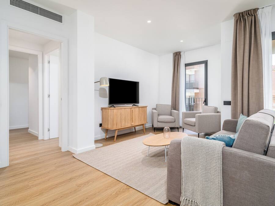 Two-Bedroom Family Apartment with Terrace | Living area | 50-inch flat-screen TV with cable channels