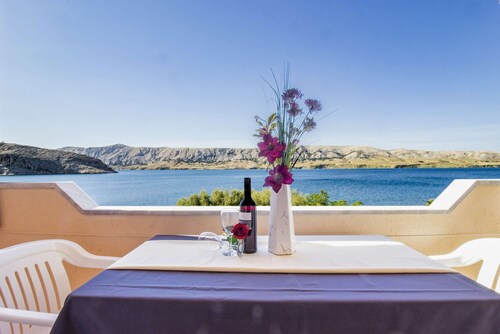 Apartment directly at the sea with slipway and boat mooring