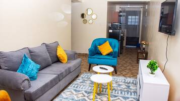 Apartamento urbano | Área de estar | Smart TV 24 polegadas com canais digitais