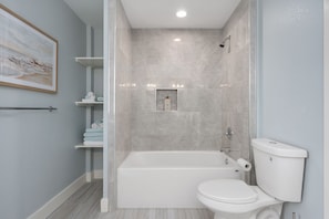 Shower, hair dryer, towels, shampoo