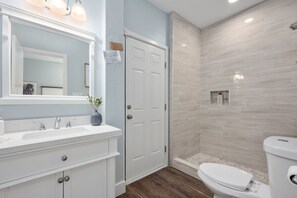 Shower, hair dryer, towels, shampoo