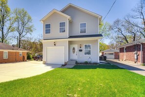 A two-story residential house with a front garage, a well-maintained lawn, and a clear sky. - Louisville Retreat w/ Deck ~ 11 Mi to Downtown! (Louisville)