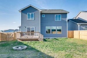 Enjoy outdoor activities on the spacious deck and relax by the fire pit in the well-maintained yard.