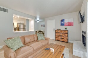 Apartment (1 Bedroom) | Living area | TV, fireplace - Near Stadiums: Grand Prairie Apt w/ Pool Access (Grand Prairie)