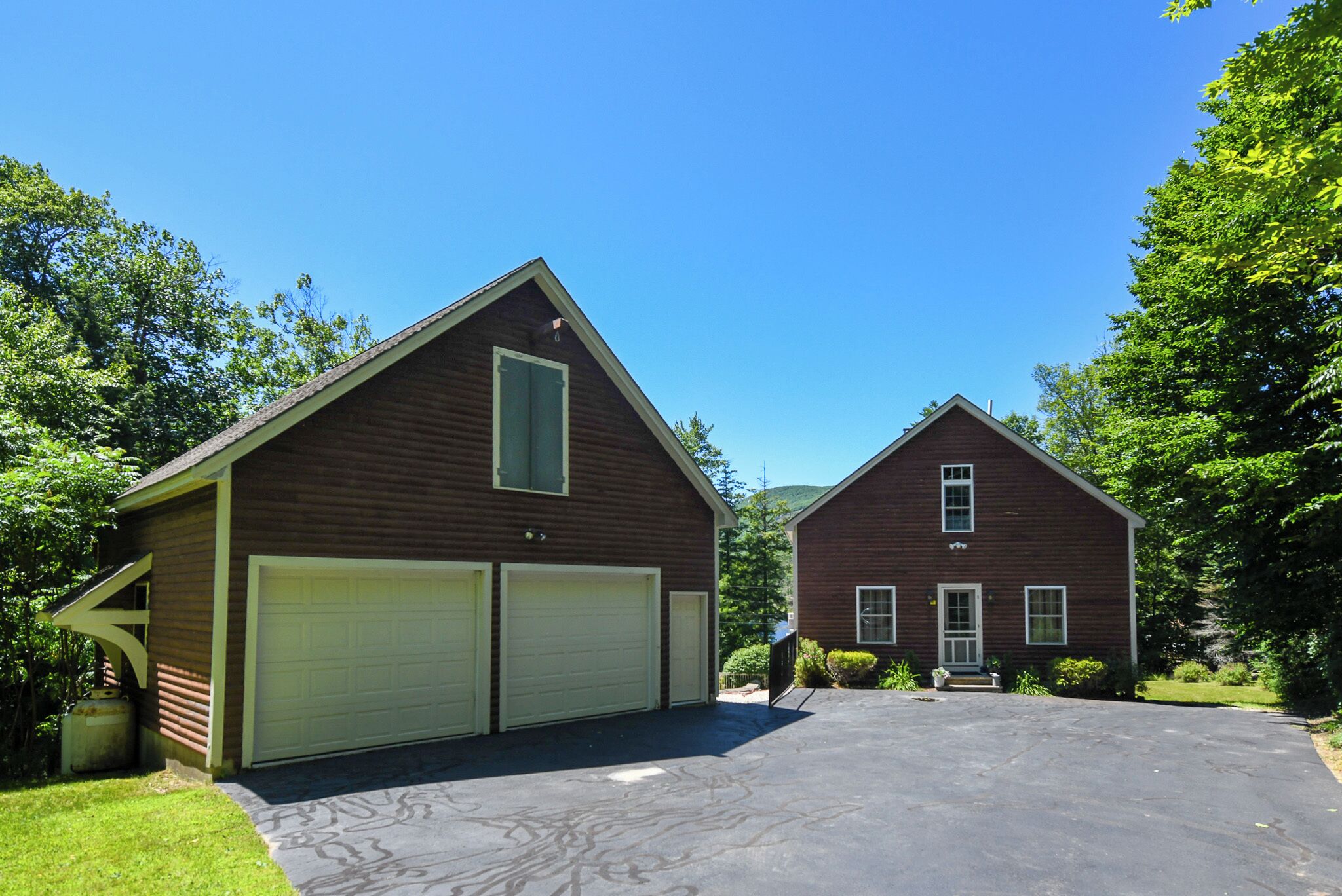 Waterfront home with in-ground pool and stunning views of Pleasant Mountain!