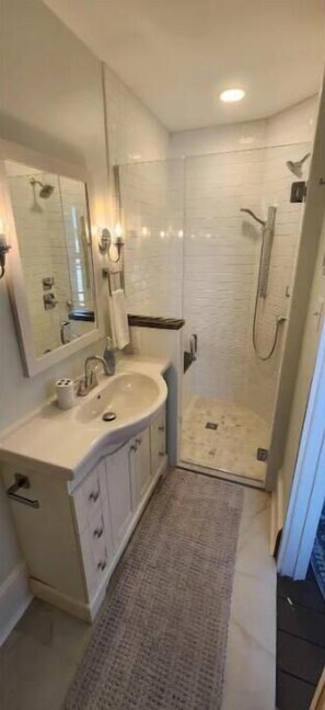 Shower, hair dryer, towels, toilet paper