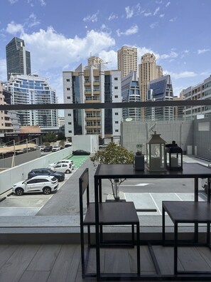 Enjoy the city view from our rooftop terrace with tables and chairs.