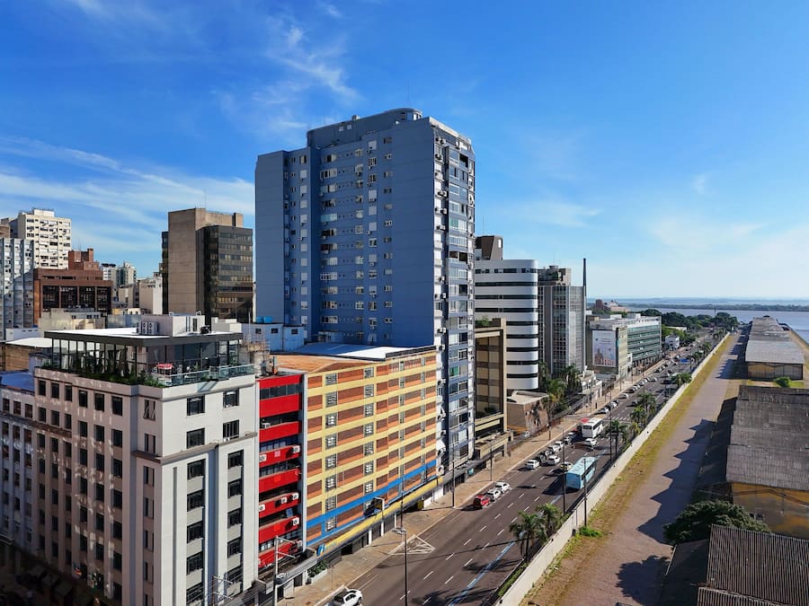 A multi-story building with a modern design, featuring a mix of residential and commercial spaces.