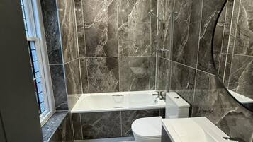 Apartment | Bathroom | Combined shower/tub, deep soaking tub, towels