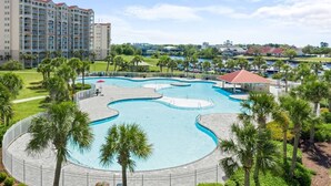 A hotel with a large swimming pool, palm trees, and a view of the surrounding area. - Tee & Sea Paradise- Pool- Slps 11- Golf View-Grill (North Myrtle Beach)