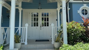 A two-story house with a porch, a front door, and a mailbox. - Beachcombers villa, Porters Court, Fairmont beach passes, few meters to Lonestar (Porters)