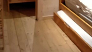 A wooden-paneled room with a bed, a window, and a door. - Chalet, 350m from ski slopes, parking, tv, 104m², Les Gets (Les Gets)