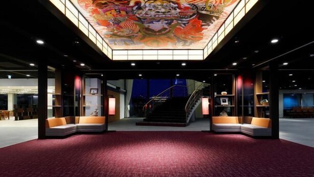 A spacious lobby with a red carpet, a staircase, and a colorful ceiling mural. - Mercure Saga Karatsu Resort (Karatsu)