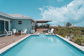 Outdoor pool, a heated pool - Silver Palms Retreat, Family home with heated pool, steps to Tropic of Cancer! (Moore Hill)