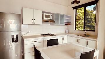 Microwave, stovetop, coffee/tea maker, cookware/dishes/utensils