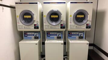 Three identical CO/N DRYER 45 machines with a 5kg capacity, each with a digital display and control panel.