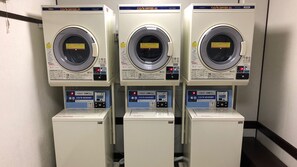 Three identical CO/N DRYER 45 machines with a 5kg capacity, each with a digital display and control panel. - Misasa Royal Hotel (Misasa)