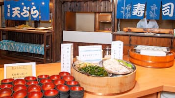 A buffet setup with various dishes and serving utensils.