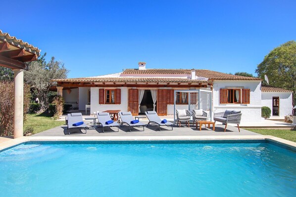 A two-story house with a swimming pool, outdoor seating, and a garden. - H2927 Finca Alegre near Pollenca for 4 persons with pool (Pollenca)