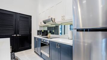 A modern kitchen with stainless steel appliances, a microwave, and a built-in oven.