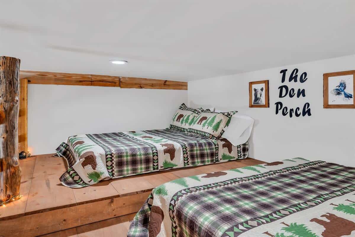 Loft sleeping area features two double beds, comfortably accommodating up to four guests.