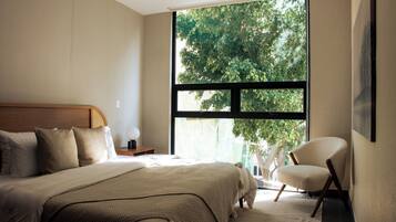 Deluxe Apartment | In-room safe, desk, blackout drapes, iron/ironing board