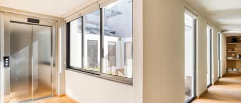 Deluxe Apartment | Living area | 32-inch Smart TV with digital channels