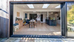 A modern interior with a dining area, kitchen, and open space.