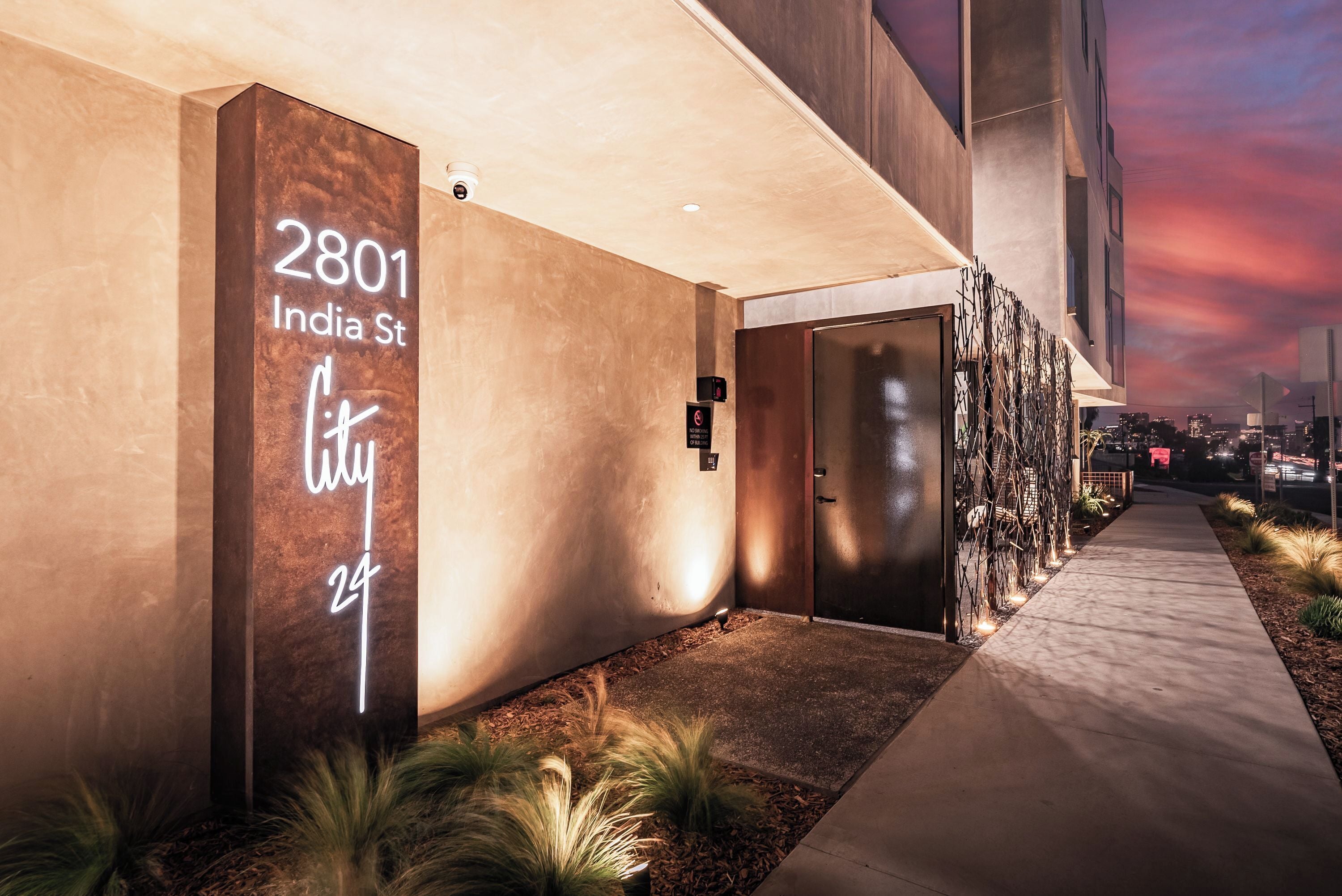 A modern building entrance with a sign reading "2801 India St."