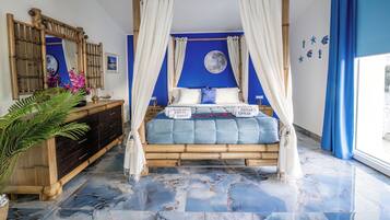 A room with a four-poster bed, a large mirror, a nightstand, and a potted plant.