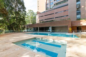 Outdoor pool, a heated pool - New luxury apartment surrounded by forest (Medellín)