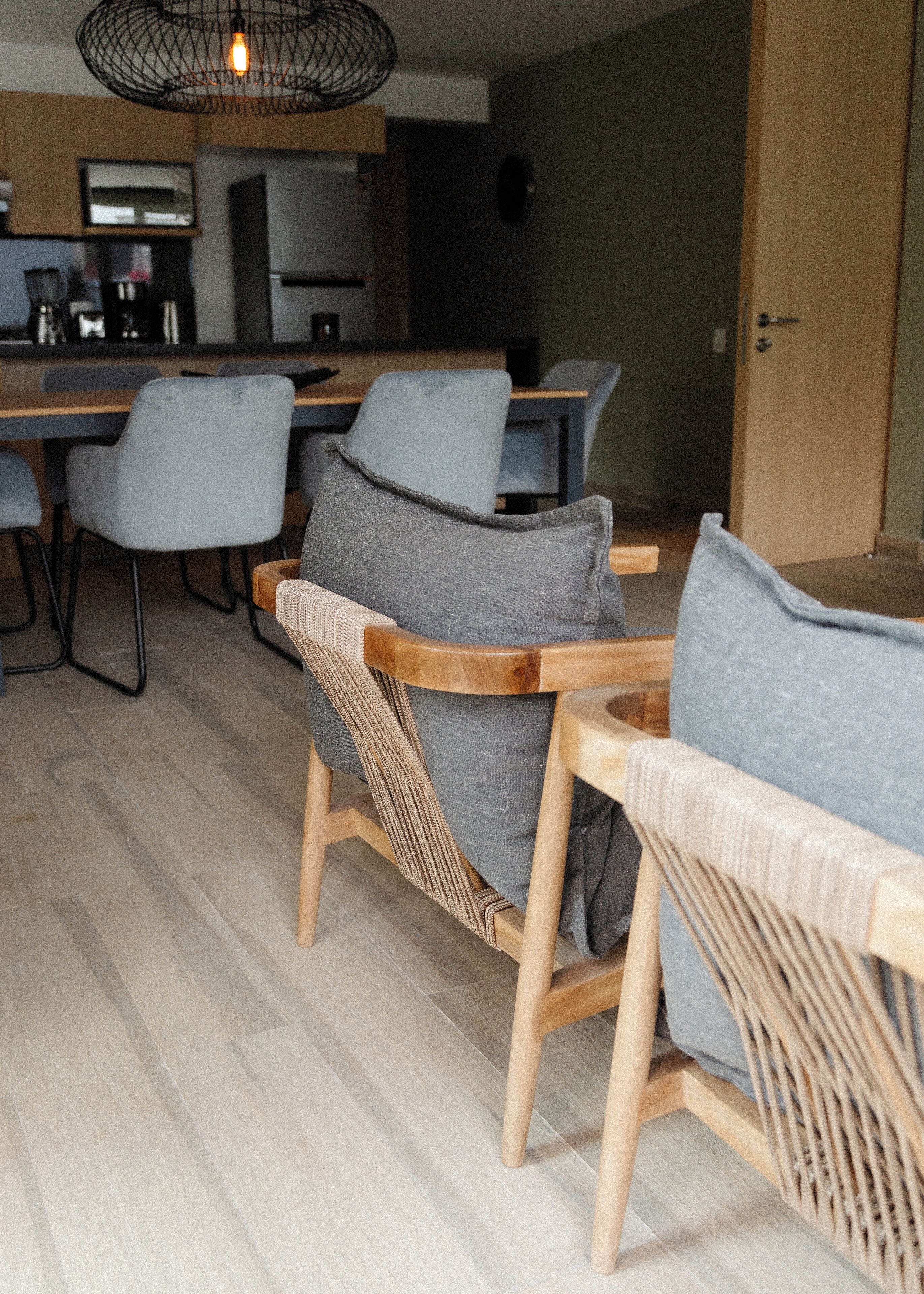 A modern kitchen with a dining area.