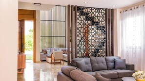 Family Villa, 4 Bedrooms, Private Pool | Living area | 50-inch Smart TV with cable channels, heated floors