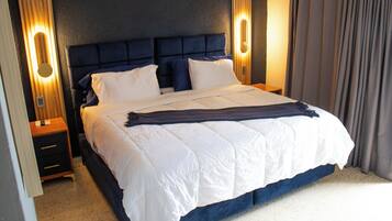 Premium bedding, in-room safe, blackout drapes, soundproofing
