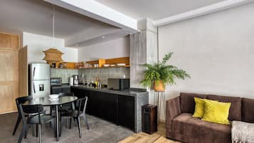 Elite Apartment | Living area | 32-inch Smart TV with digital channels