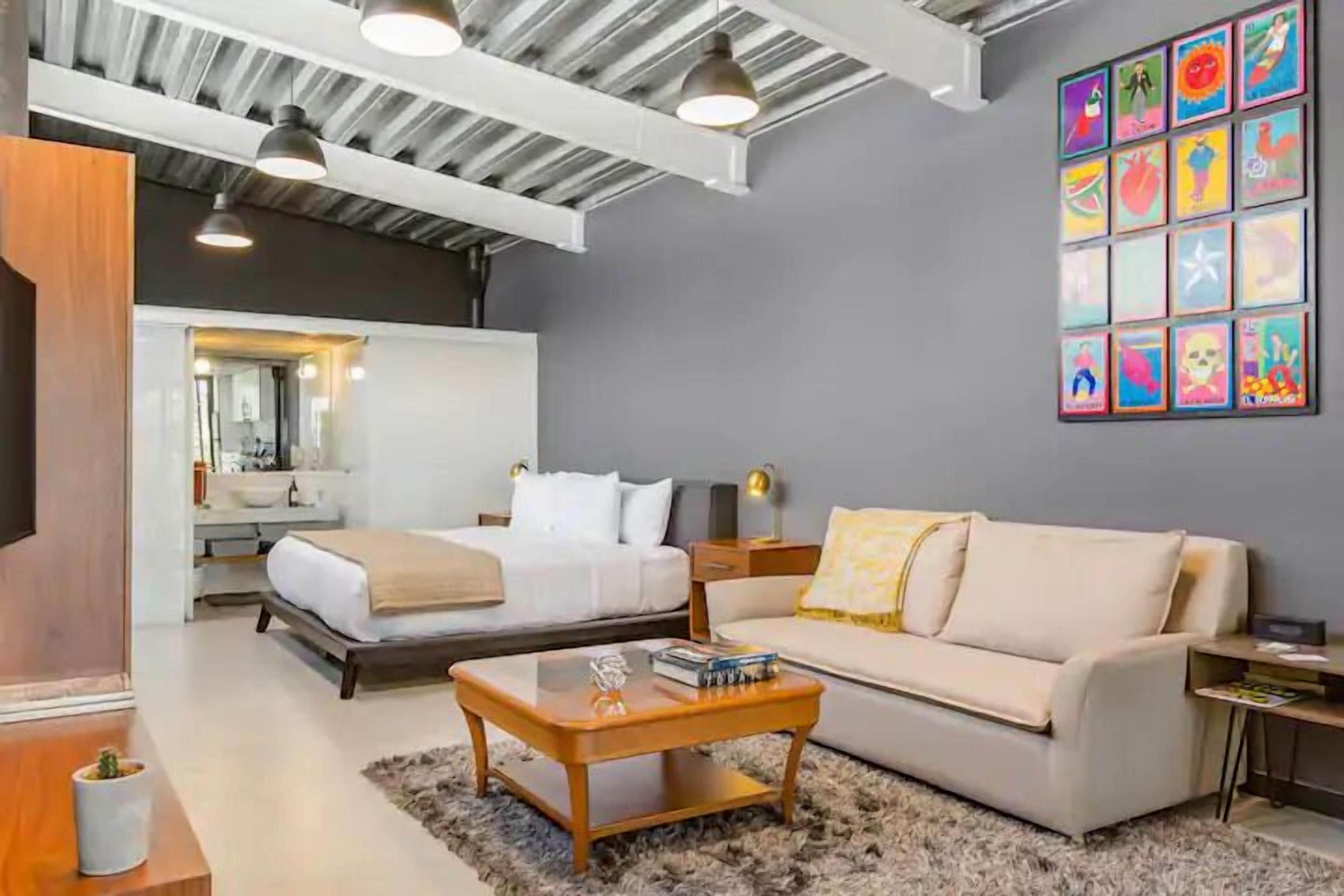 Executive Loft | Living area | 42-inch flat-screen TV with digital channels