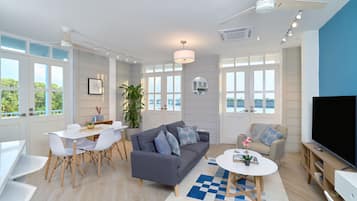 Apartment (1D) | Living area | 40-inch Smart TV with cable channels