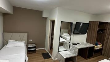 Deluxe Room | 1 bedroom, desk, laptop workspace, blackout drapes