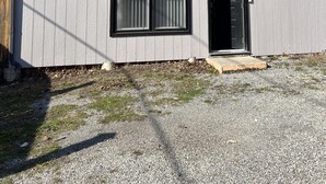 A two-story house with a dark roof, white siding, and a black door. - The Merlot, minutes to Niagara's Falls, 3 bedrooms with Hottub and Sauna (Niagara Falls)