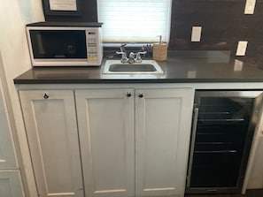 Fridge, microwave, cookware/dishes/utensils, spices