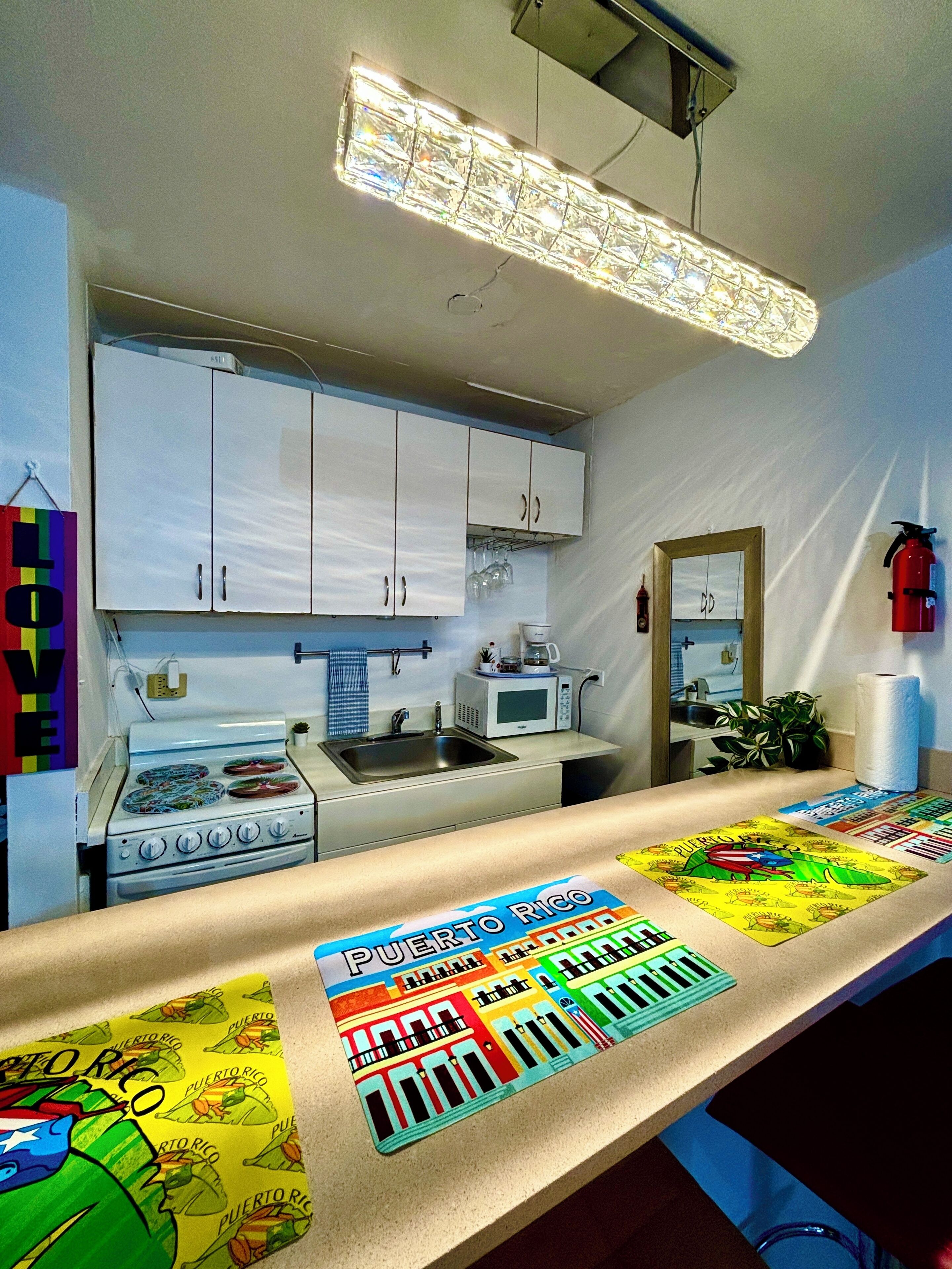 Fridge, microwave, stovetop, coffee/tea maker