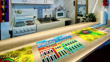 Fridge, microwave, stovetop, coffee/tea maker