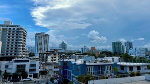 A cityscape with various buildings, including high-rise apartments and commercial structures.