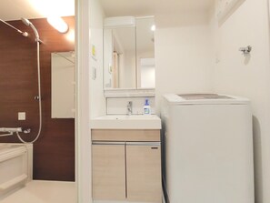A bathroom with a shower, a sink, a mirror, and a toilet. - RDBBF32_201 / Chuo-ku Tokyo (Chuo-ku)