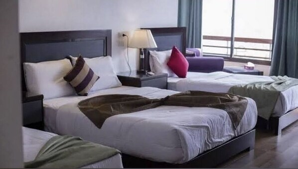 Triple Room | 1 bedroom, in-room safe, individually decorated, blackout drapes