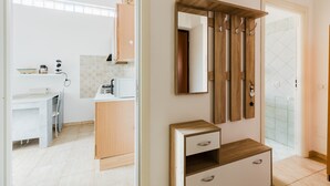 A modern bathroom with a wooden vanity, a mirror, and a glass shower door. - Apartment 'Casa Rimedia' with Balcony, Wi-Fi and Air Conditioning (Solanas)
