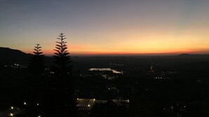 A nighttime view of a cityscape with a sunset. - Ban Rai Rabeangmok (Khao Kho)