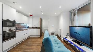 Premium Apartment, Kitchen, City View | Living room | 50-inch Smart TV with satellite channels