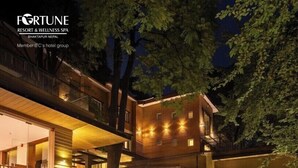 A modern, multi-story hotel with a warm, inviting entrance and outdoor seating area. - Fortune Resort & Wellness Spa Bhaktapur, Nepal - Member ITC Hotels' Group (Suryabinayak)